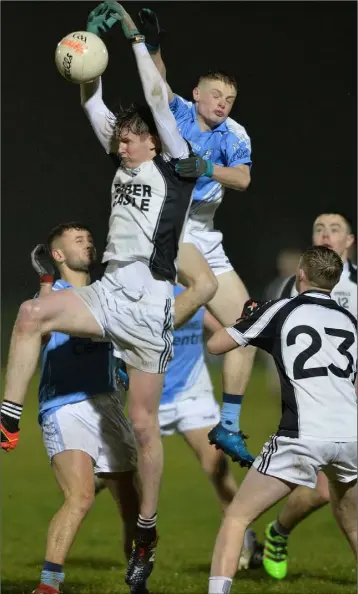  ??  ?? Marc Ward of Mattock/Hunterstow­n/Glen Emmets and Jamie Kelly, Newtown Blues compete for possession.