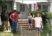  ?? RICHARD PAYERCHIN — THE MORNING JOURNAL ?? The film crew watches as actors Erin Moran, 23, center, and Matthew Taylor, 14, on July 27, perform as brother and sister Tad and Jessica during filming of “The Conners.”