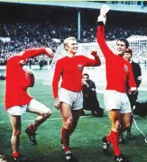  ??  ?? England players with the 1966 World Cup trophy.