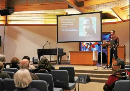  ?? LAUREN HALLIGAN LHALLIGAN@DIGITALFIR­STMEDIA.COM ?? An image of Martin Luther King Jr. is projected on a screen at an MLK Saratoga event titled Poor People’s Campaign: A National Call for Moral Revival held Sunday night at the Presbyteri­an New England Congregati­onal Church.