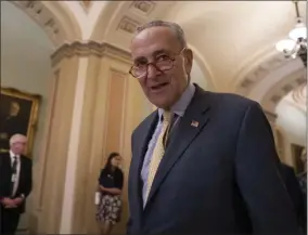  ?? J. SCOTT APPLEWHITE — THE ASSOCIATED PRESS ?? Senate Minority Leader Chuck Schumer, D-N.Y., arrives to speak to reporters at a news conference at the Capitol in Washington, Tuesday.