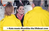  ??  ?? > Kate meets Mumbles the lifeboat crew
