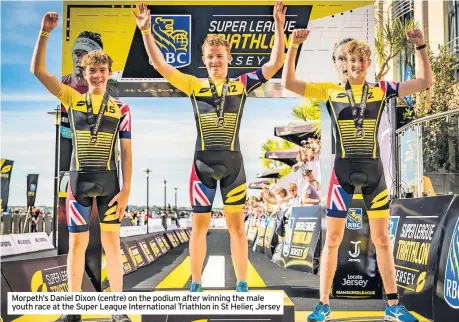  ??  ?? Morpeth’s Daniel Dixon (centre) on the podium after winning the male youth race at the Super League Internatio­nal Triathlon in St Helier, Jersey