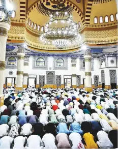  ?? Clint Egbert/Gulf News ?? People offer Eid prayers at Al Farooq Omar Bin Al Khattab Mosque (Blue Mosque) in Dubai yesterday.