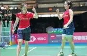  ?? ?? World No 1 pair Chen Qingchen and Jia Yifan win the women’s doubles gold at the BWF World Tour Finals.