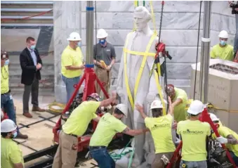  ??  ?? Workers prepare to remove the statue of Jefferson Davis from the Kentucky state Capitol on Saturday.