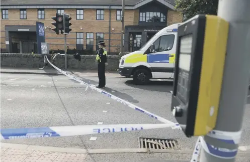  ?? PICTURE: SWNS.COM ?? 0 Police at the pedestrian crossing near Drylaw police station on Ferry Road, Edinburgh, where a ten-year-old boy was knocked down by a rider on a stolen motorcycle on Saturday evening