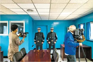  ?? LAM YIK FEI/THE NEW YORK TIMES FILE PHOTO ?? Soldiers stand guard in 2017 inside the meeting room that straddles the border between North and South Korea in Panmunjom along the Demilitari­zed Zone. Among the many questions about a meeting between President Donald Trump and Kim Jong-un, the North...