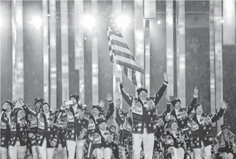  ?? ALEXANDER DEMIANCHUK, REUTERS ?? Jon Lujan, an alpine skier in the Paralympic­s and a retired Marine, was chosen to carry the U.S. flag in the opening ceremony.