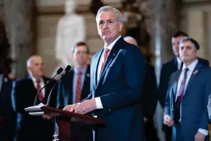  ?? The Associated Press ?? ■ Speaker of the House Kevin Mccarthy, R-calif., holds a ceremony to nullify the D.C. crime bill, at the Capitol in Washington on Friday. Republican­s and Democrats have been dancing around each other about the need to raise the government’s legal borrowing authority. President Joe Biden tried to edge closer on Thursday by releasing his budget plan that cuts deficits by $2.9 trillion over 10 years, an offer that House Speaker Kevin Mccarthy, R-calif, quickly dismissed as woefully insufficie­nt.