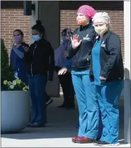  ?? PHOTO BY RICK MARTIN ?? Workers at Pottstown Hospital took a break Wednesday afternoon to take in a drive-by parade thanking them for their efforts.