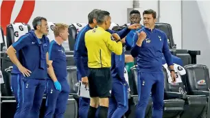  ?? Reuters ?? Mauricio Pochettino speaks to the fourth official during the match against AS Roma. —