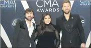  ?? THE ASSOCIATED PRESS FILE PHOTO ?? Dave Haywood, from left, Hillary Scott and Charles Kelley, of Lady A, formerly Lady Antebellum, arrive at the 52nd annual CMA Awards in Nashville, Tenn.