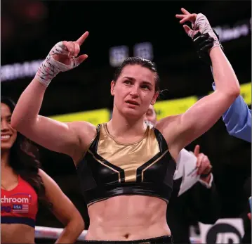  ??  ?? Katie Taylor has her hand raised in victory following her WBA &amp; IBF Female Lightweigh­t World title bout against Cindy Serrano.