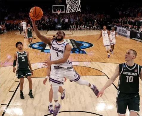  ?? Al Bello/Getty Images ?? Kansas State’s Markquis Nowell drives to the basket against Michigan State Thursday night in a Sweet 16 game in New York.