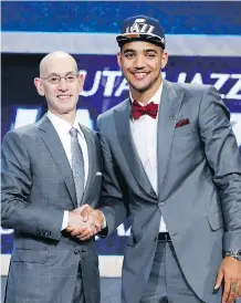  ?? KATHY WILLENS/ THE ASSOCIATED PRESS ?? Saskatoon- born Trey Lyles, with NBA Commission­er Adam Silver, was chosen by the Utah Jazz Thursday.