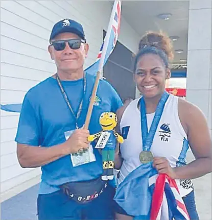  ?? Picture: SUPPLIED ?? Deborah Bulai with Athletics Fiji head coach Albert Miller at the Pacific Games in the Solomon Islands last year.