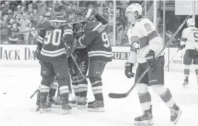  ?? SCOTT KANE/AP ?? The Blues’ Brayden Schenn is congratula­ted by teammates after scoring a goal Tuesday against the Panthers in St. Louis.