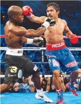  ??  ?? Manny Pacquiao exchanges blows with Timothy Bradley during their WBO welterweig­ht title match at the MGM Grand Arena.