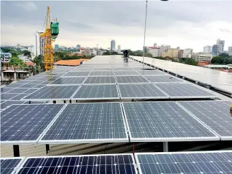  ??  ?? Giant solar panel project that Solanra Company completed recently at ‘Lady J’ shopping complex in Colombo Jurawatt solar panel
