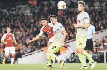  ??  ?? Alexis Sanchez (second left) shoots to score their second goal during the UEFA Europa League Group H match against FC Cologne at The Emirates Stadium in London. — AFP photo