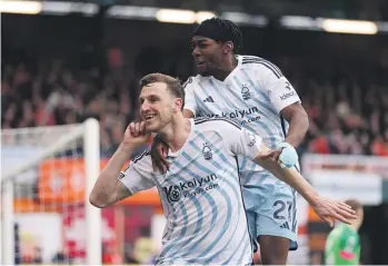  ?? GETTY IMAGES ?? Chris Wood celebrates scoring a goal for Nottingham Forest with team-mate Anthony Elanga against Luton Town in March.