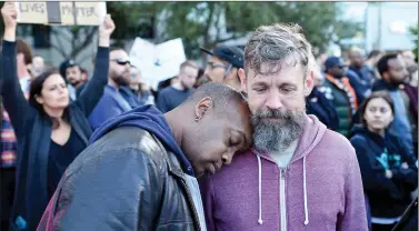  ??  ?? People react during a rally at Justin Herman Plaza in San Francisco, California on Friday.