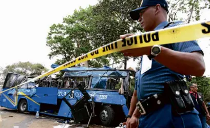  ?? —NIÑO JESUS ORBETA ?? Fifteen people died after this bus, carrying students on a school trip, crashed in Tanay town in Rizal province in February. Local officials describe the accident as the worst in Tanay’s history.