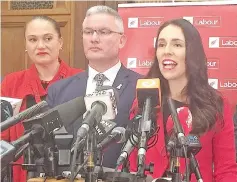  ??  ?? Ardern (right) speaks next to colleagues during a media conference in Wellington. — Reuters photo