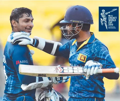  ?? Picture: AFP ?? PLENTY PLEASED: Kumar Sangakkara (left) and Lahiru Thirimanne congratula­te each other after beating England.