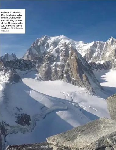  ?? Photo Dolores Al Shelleh ?? Dolores Al Shelleh, 27, a Jordanian who lives in Dubai, with the UAE flag on one of the Alps summits, 3,534 metres above sea level