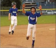  ?? STAN HUDY - SHUDY@DIGITALFIR­STMEDIA.COM ?? Saratoga Springs Little League’s Michael Mack (front) and Jack Ragle (back) celebrate Owen Redick’s walk-off grand slam as they round the bases iin Monday’s District 11⁄12 championsh­ip finale against Rotterdam/Carman.