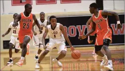  ?? STEVE JOHNSTON/DAILY SOUTHTOWN ?? Leo’s Fred Cleveland (1) leads a fast break against Bogan during the ProvisoWes­t Holiday Tournament.