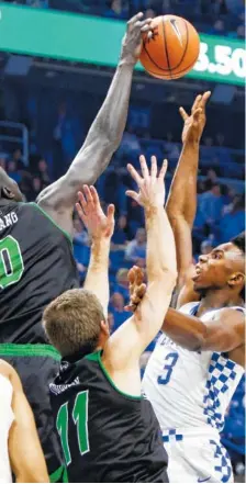  ?? THE ASSOCIATED PRESS ?? Kentucky’s Hamidou Diallo, right, has his shot blocked by Utah Valley’s Akolda Manyang on Friday night in Lexington, Ky.