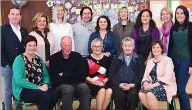  ?? Photo by Michelle Cooper Galvin ?? Bernie Costello (seated centre) at her retirement party with staff and board of management members. FRONT: Mary Anne Leane, Davy Leane, Fr Fergal Ryan PP, Maura O’Connor. BACK: Brendan O’Connor, Marguerite Casey, Marion McGill, Barry Fleming, Una White, Breda Courtney, Máire Connelly, Sinead Leane and Linda Courtney at Kilgobnet National School on Thursday.