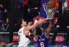  ?? MARY ALTAFFER - THE ASSOCIATED PRESS ?? New York Knicks guard Elfrid Payton (6) goes to the basket against Portland Trail Blazers center
Enes Kanter (11) during the second half of an NBA basketball game, Saturday, Feb. 6, 2021, in New York. The Knicks won 110-99.