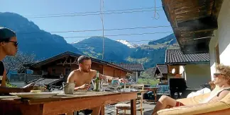  ??  ?? Purucker, left, on day four of a strict lockdown with his flatmates at their home in Mayrhofen. He says the whole country being in lockdown has brought about a new sense of community that didn’t previously exist.