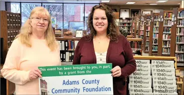  ?? Photo Provided ?? Pictured: l-r: Adams Public Library Staff: Andrea Busick, grant coordinato­r and Adult Services Librarian is with Sheila Heimann, Reference. They are picture with the tax forms available at the library.