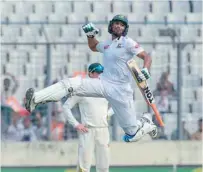  ?? — AFP ?? Bangladesh’s Mahmudulla­h Riyad reacts after scoring a century during the fourth day of the second Test against Zimbabwe in Dhaka.