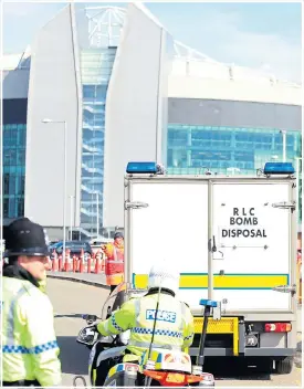  ??  ?? Police escort for an Army bomb disposal team at Old Trafford yesterday