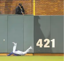  ?? Michael Macor / The Chronicle 2016 ?? The Cubs’ Albert Almora dives in Triples Alley, where long drives that would be homers in other parks aren’t in S.F.