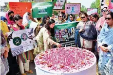  ?? APP ?? Participan­ts light candles during a solidarity rally on the occasion of Youm-e-Takreem Shuhada-e-Pakistan.