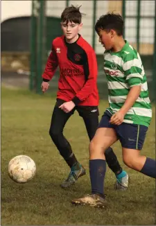  ??  ?? Joe Doyle of Camolin Celtic tracking Fabio Feitinha (Gorey Celtic).