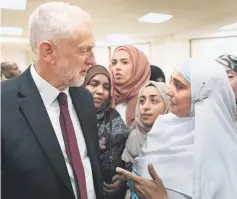  ??  ?? Britain’s opposition Labour Party leader, Jeremy Corbyn, meets local people in Finsbury Park Mosque, near the scene of an attack, in London, Britain. — Reuters photo