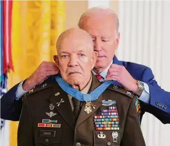  ?? Evan Vucci/Associated Press ?? President Joe Biden presents the Medal of Honor for heroism during the Vietnam War to retired Army Col. Paris Davis, 83, on Friday at the White House.