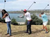  ?? Picture: SUPPLIED ?? AIMING HIGH: From left, Port of East London manager Sharon Sijako, golfer Lwazi Gqira and coach Michelle De Vries