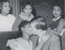  ??  ?? 0 John Carlisle and Leonie Forbes kiss as actors await auditions for Emergency Ward 10, started today in 1957