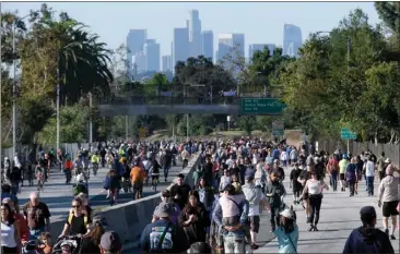  ?? DEAN MUSGROVE — STAFF PHOTOGRAPH­ER ?? The second ArroyoFest on Sunday allowed walkers, cyclists and skaters to take life in the slow lane along the 110Freeway.