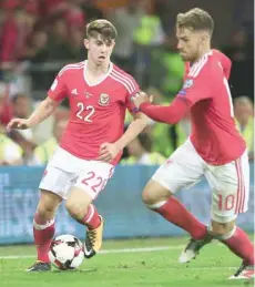  ?? — AFP ?? Wales’ striker Ben Woodburn runs with the ball during the Fifa World Cup 2018 qualifier against Austria in Cardiff on Saturday.