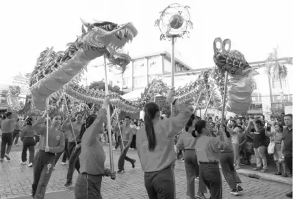  ?? JOY TORREJOS ?? A dragon dance was one of the attraction­s in yesterday’s Red Lantern Festival organized by the Cebu City government in celebratio­n of the Chinese New Year.